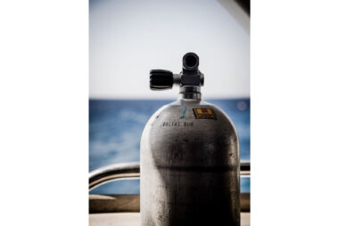 Close up photograph of a scuba diving cylinder or tank photographed looking out to sea- diving photography by Richard Boll.