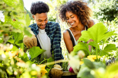 A couple of people gardening in an allotment, photographed for a London lifestyle photography campaign.