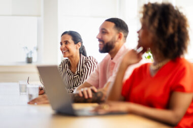 Three people in an informal meeting by contemporary lifestyle photographer Richard Boll.